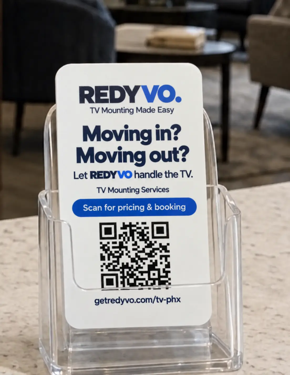 Actual REDYVO Moving in or Moving out resident QR card displayed in a clear leasing-office holder
